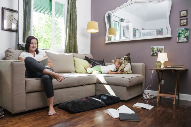 woman-reading-book-boy-lying-min